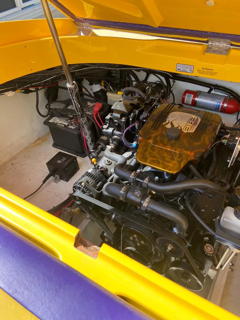 Slide: The Image of 2001 Baja H2X engine compartment with yellow and purple accents. - 32