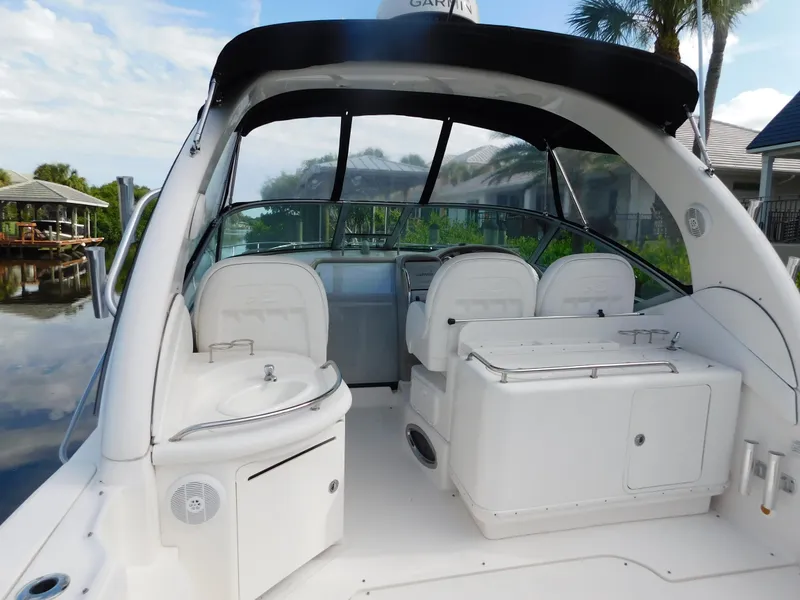 Slide: The Image of 2006 Sea Ray 340 Sundancer boat interior with seating and helm station. - 12