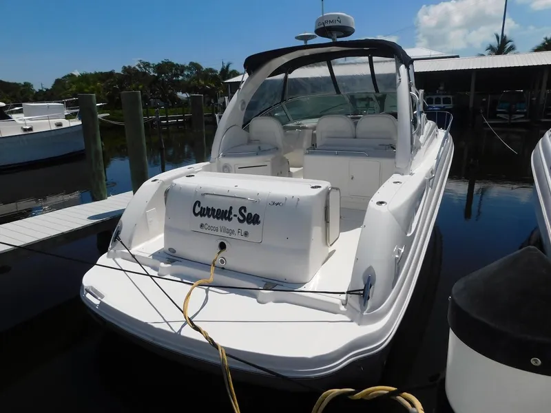 Slide: The Image of 2006 Sea Ray 340 Sundancer docked at marina, rear view. - 2