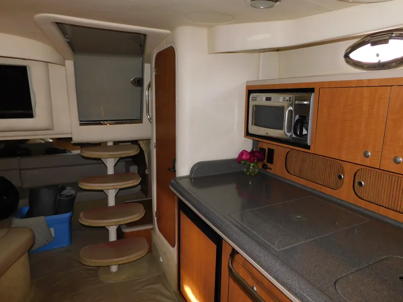 Slide: The Image of Interior of 2006 Sea Ray 340 Sundancer yacht with kitchenette and stairs. - 20