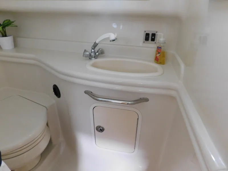 Slide: The Image of 2006 Sea Ray 340 Sundancer bathroom with sink, faucet, and toilet. - 27