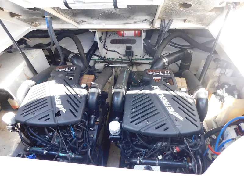 Slide: The Image of 2006 Sea Ray 340 Sundancer engine compartment with twin MerCruiser engines. - 30
