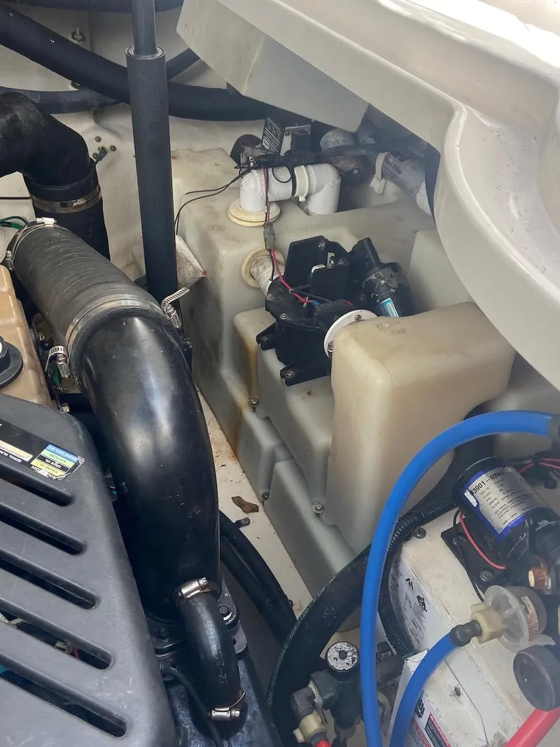 Slide: The Image of Engine compartment of a 2006 Sea Ray 340 Sundancer boat showing various components. - 34