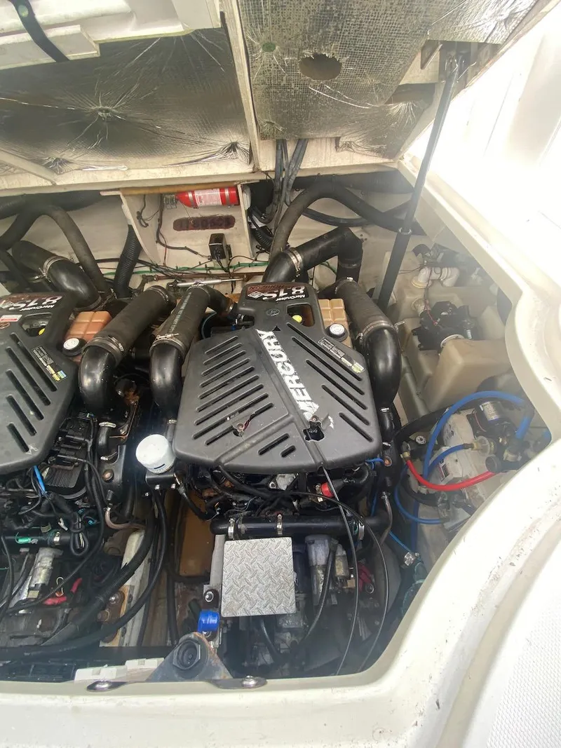 Slide: The Image of 2006 Sea Ray 340 Sundancer engine compartment with twin MerCruiser engines. - 35