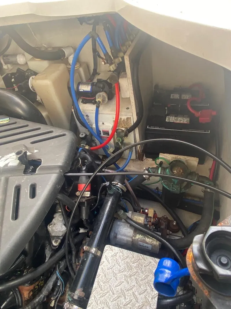 Slide: The Image of Engine compartment of a 2006 Sea Ray 340 Sundancer boat showing various components and wiring. - 38