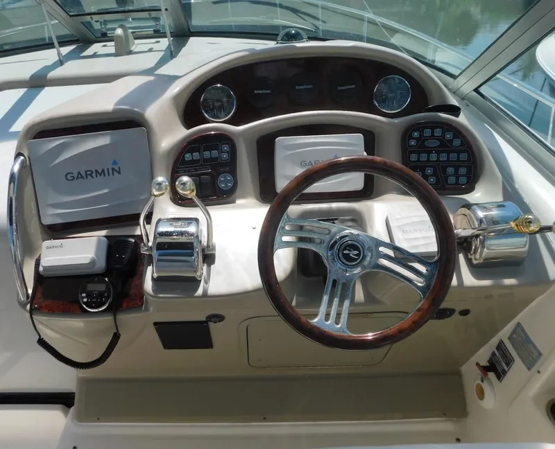 Slide: The Image of Helm of 2006 Sea Ray 340 Sundancer with Garmin navigation system and wood-trimmed steering wheel. - 6