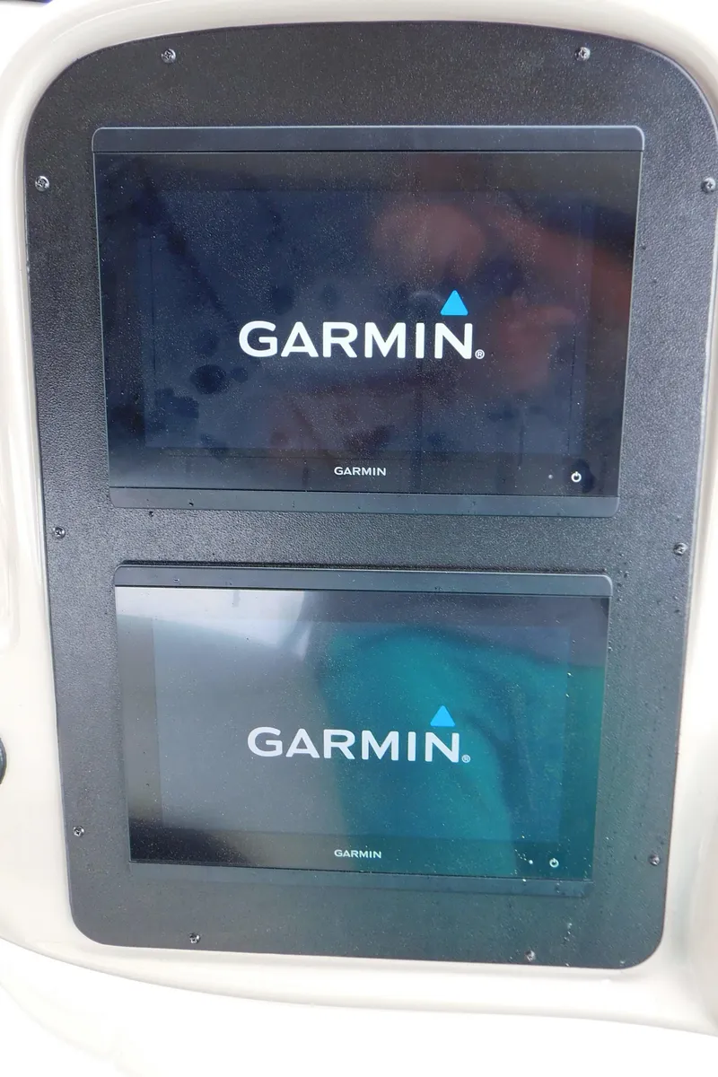 Slide: The Image of Garmin navigation screens on 2002 Sea Ray 380 Sundancer boat dashboard. - 15