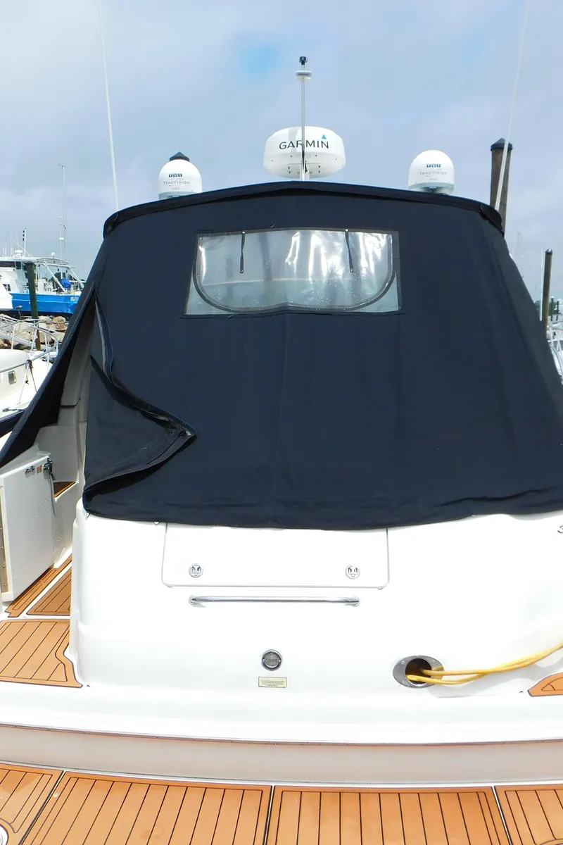 Slide: The Image of 2002 Sea Ray 380 Sundancer with black canvas cover at the stern. - 2