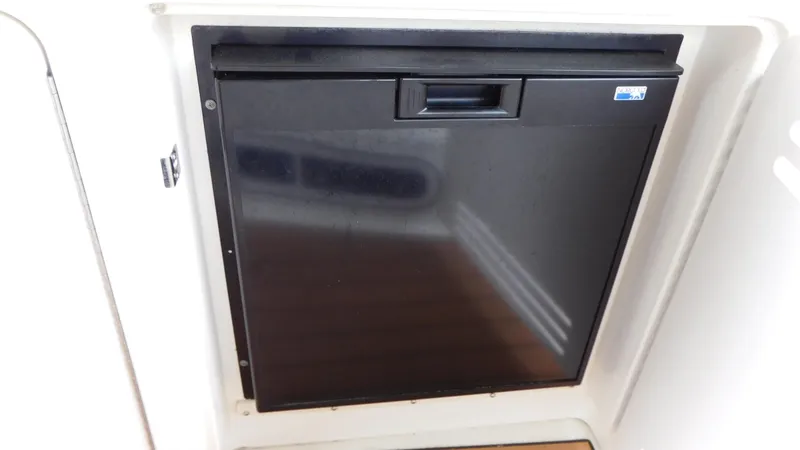 Slide: The Image of Black mini fridge on 2002 Sea Ray 380 Sundancer boat. - 9