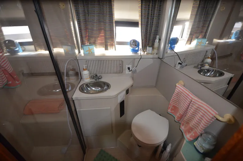 Slide: The Image of Bathroom interior of 1991 Carver 33 Aft Cabin yacht with sink and toilet. - 29