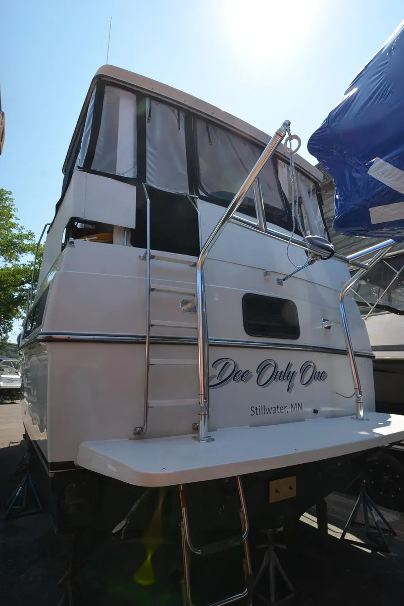 Slide: The Image of 1991 Carver 33 Aft Cabin boat, rear view, docked in Stillwater, MN. - 3
