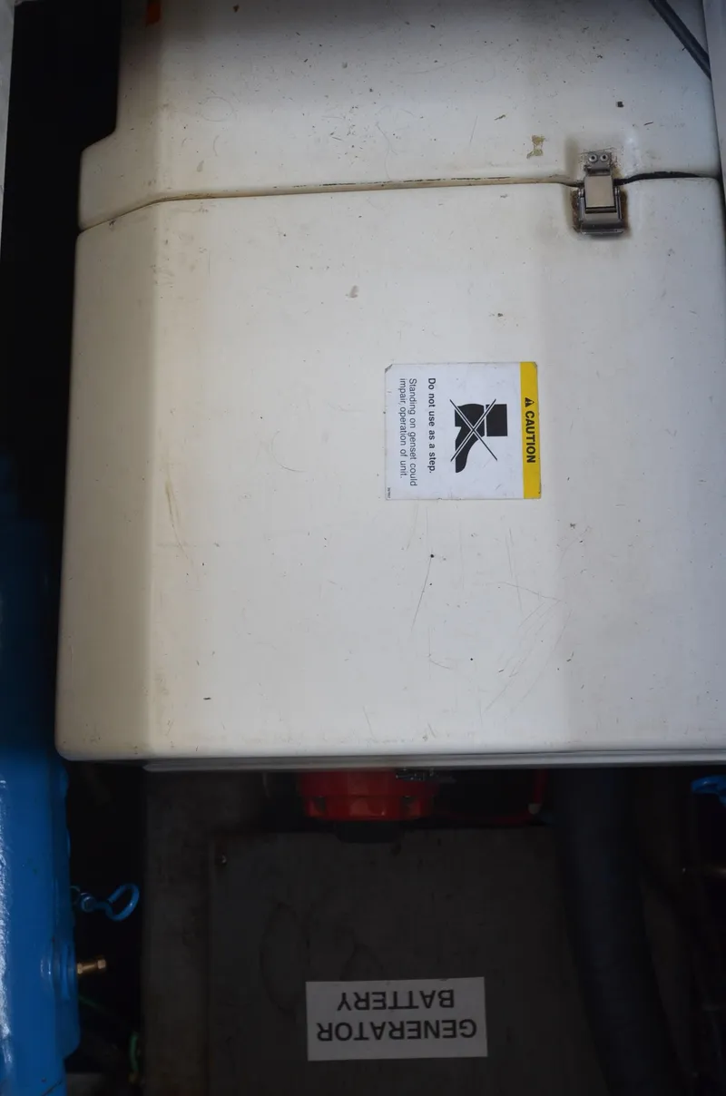 Slide: The Image of Generator battery compartment on a 1991 Carver 33 Aft Cabin boat. - 7