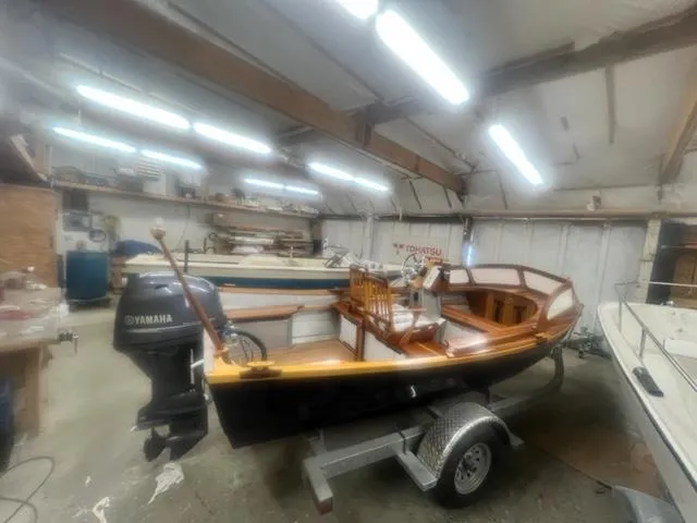 Slide: The Image of Custom 17 boat, 2021 model, in a workshop with Yamaha outboard motor. - 3