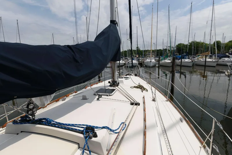 Slide: The Image of 1987 Pearson 36-2 sailboat docked at a marina, view of the deck and rigging. - 2