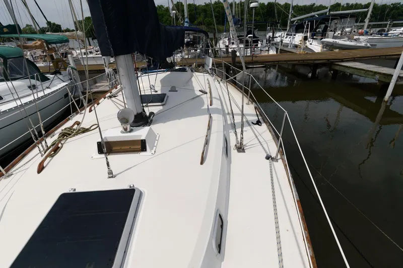 Slide: The Image of 1987 Pearson 36-2 sailboat docked at a marina. - 4
