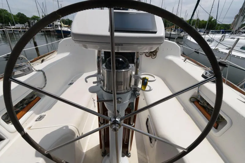 Slide: The Image of Cockpit of 1987 Pearson 36-2 sailboat with steering wheel and navigation equipment. - 5