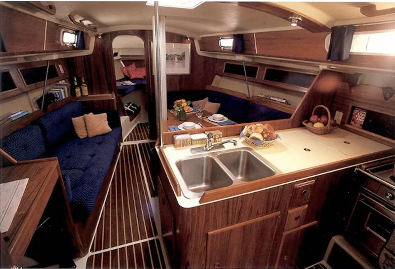 Slide: The Image of Interior of 1987 Pearson 36-2 sailboat with cozy seating, dining area, and kitchen. - 7