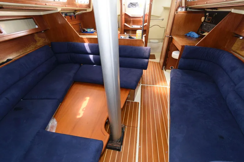 Slide: The Image of Interior of 1987 Pearson 36-2 sailboat with blue seating and wooden finishes. - 8