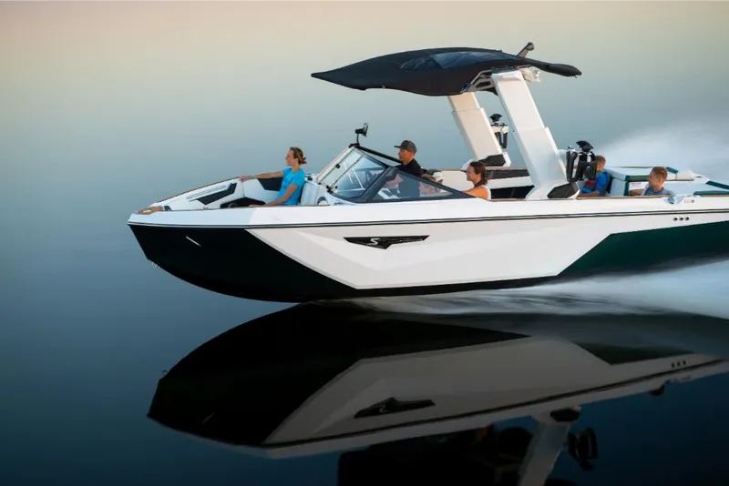 Slide: The Image of 2023 Nautique Super Air Nautique S25 boat cruising on calm water. - 5