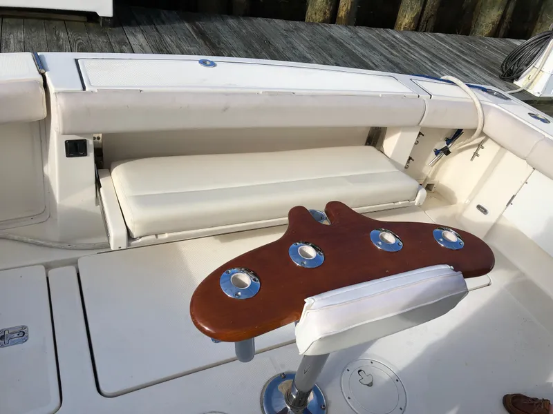 Slide: The Image of 1997 Tiara Yachts 3700 Open cockpit with seating and fishing rod holders. - 13