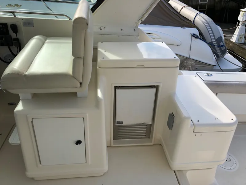 Slide: The Image of 1997 Tiara Yachts 3700 Open interior with seating and storage compartments. - 26