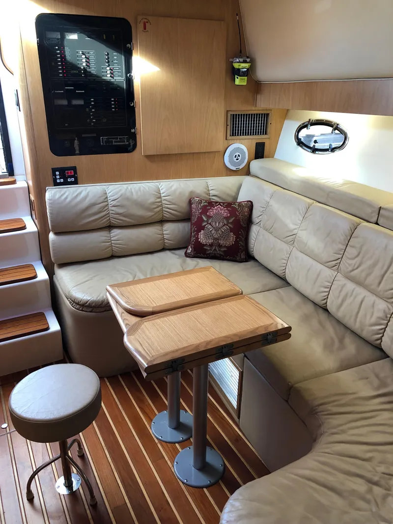 Slide: The Image of 1997 Tiara Yachts 3700 Open interior with leather seating, wooden table, and modern control panel. - 32