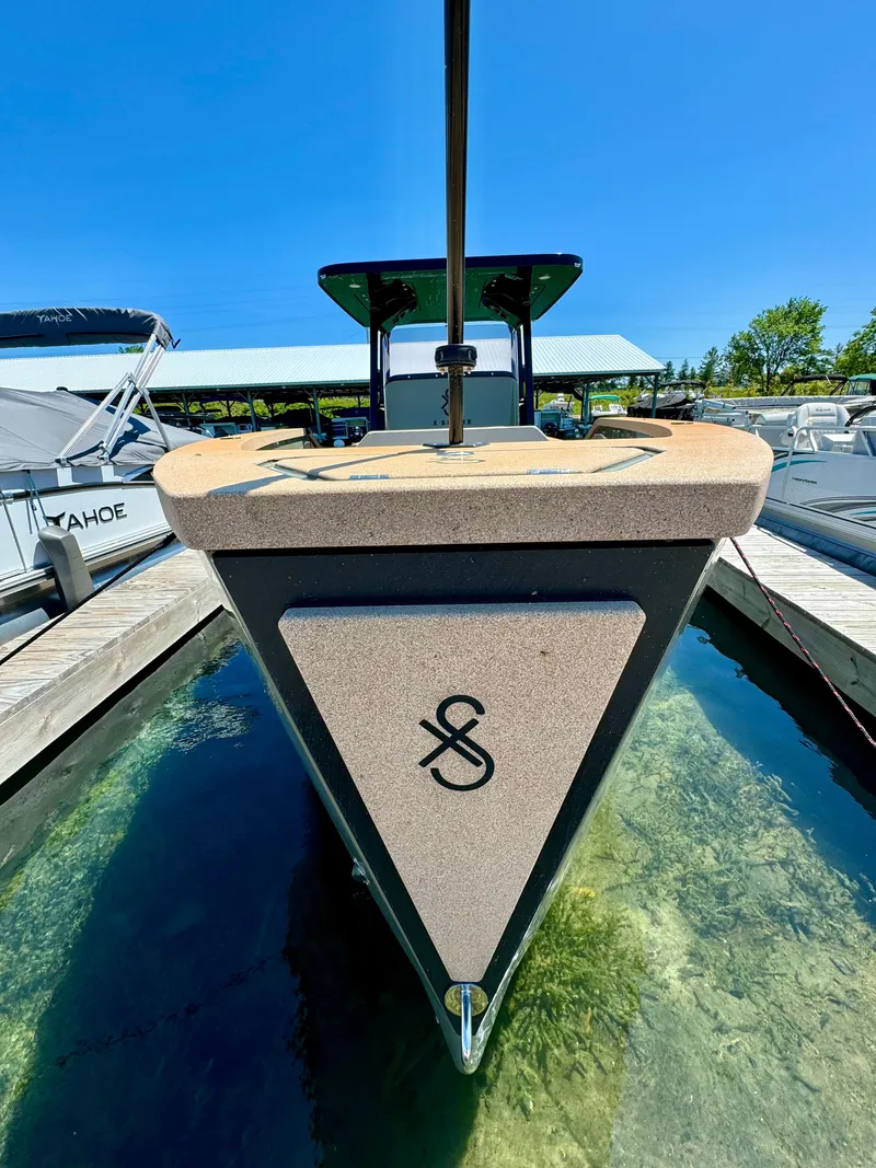 Slide: The Image of 2022 X Shore Eelex 8000 electric boat docked in clear water. - 3