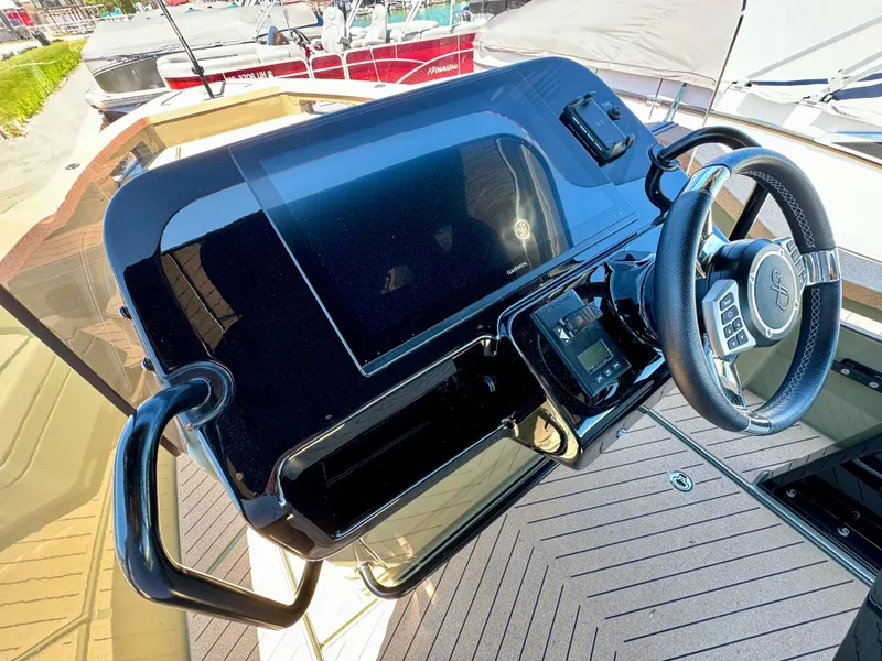 Slide: The Image of 2022 X Shore Eelex 8000 boat dashboard with steering wheel and digital display. - 5