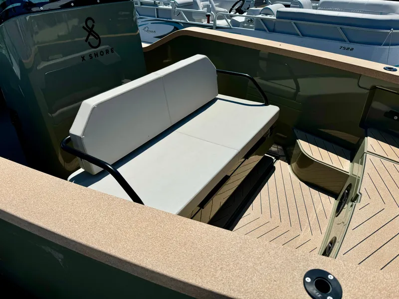 Slide: The Image of 2022 X Shore Eelex 8000 boat interior with beige seating and modern design. - 8