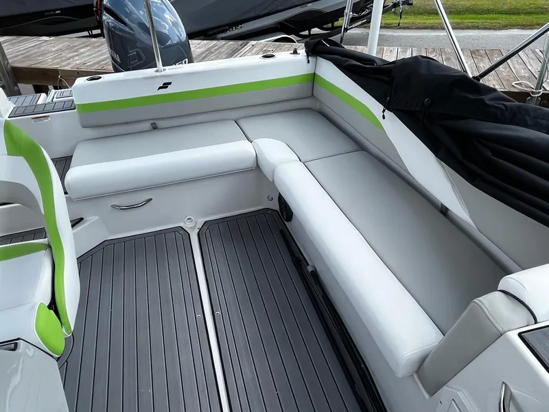 Slide: The Image of 2024 Starcraft SVX 191 boat interior with gray and green seating. - 11