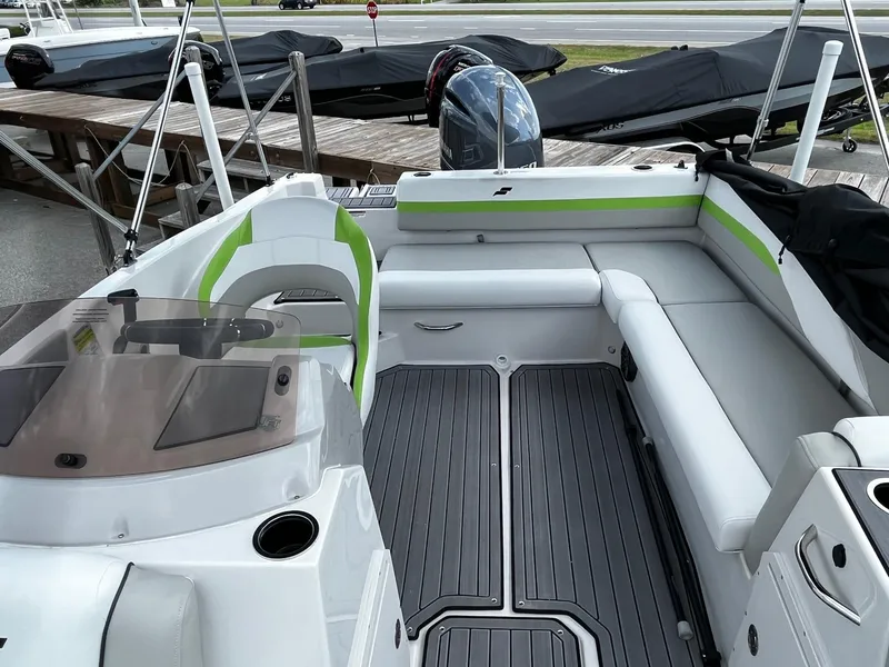 Slide: The Image of 2024 Starcraft SVX 191 boat interior with seating and helm station. - 2