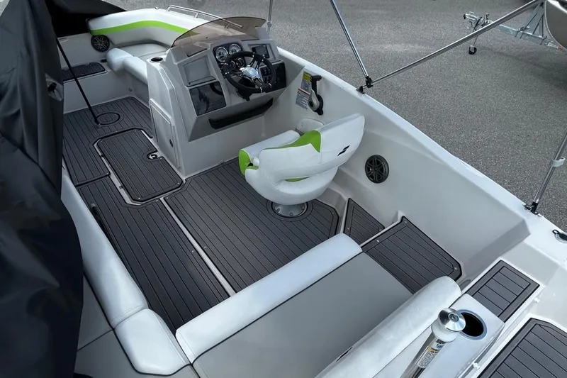 Slide: The Image of 2024 Starcraft SVX 191 boat interior with modern seating and steering console. - 3