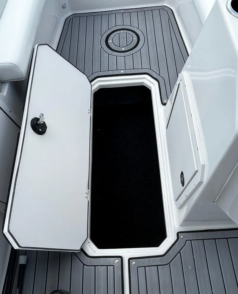 Slide: The Image of 2024 Starcraft SVX 191 boat storage compartment with open hatch. - 7
