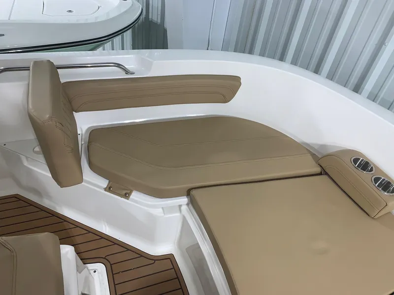 Slide: The Image of 2024 Bayliner Trophy 20CX boat interior with tan cushioned seating. - 16