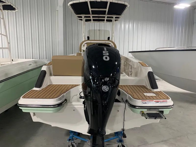 Slide: The Image of 2024 Bayliner Trophy 20CX boat with 150 HP outboard motor in showroom. - 3
