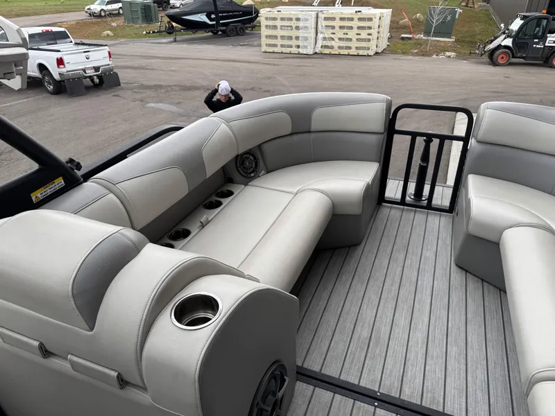 Slide: The Image of 2022 Montara SURF BOSS 25 boat interior with gray seating and cup holders. - 10