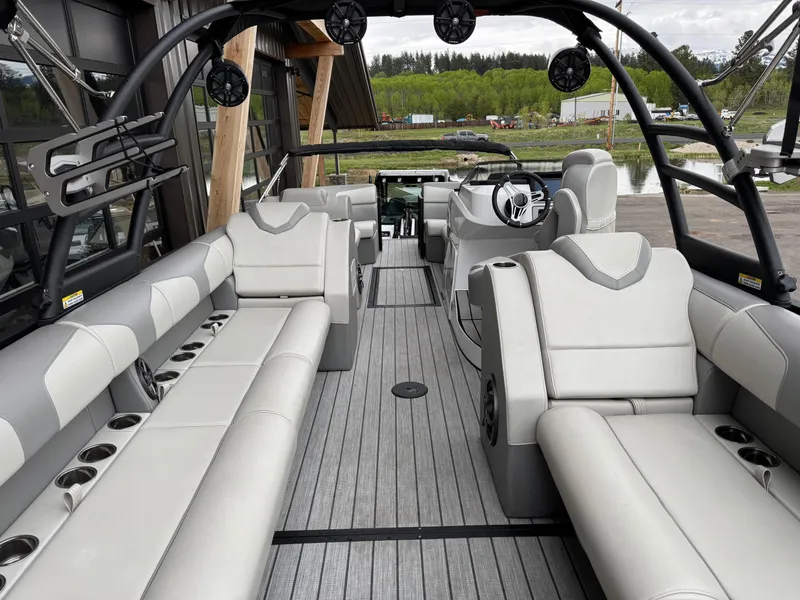 Slide: The Image of 2022 Montara SURF BOSS 25 interior with luxurious seating and modern design. - 11