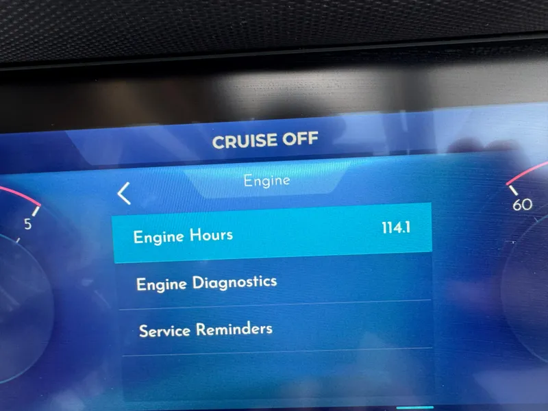 Slide: The Image of Display screen showing engine hours at 114.1 on Montara SURF BOSS 25, 2022 model. - 16