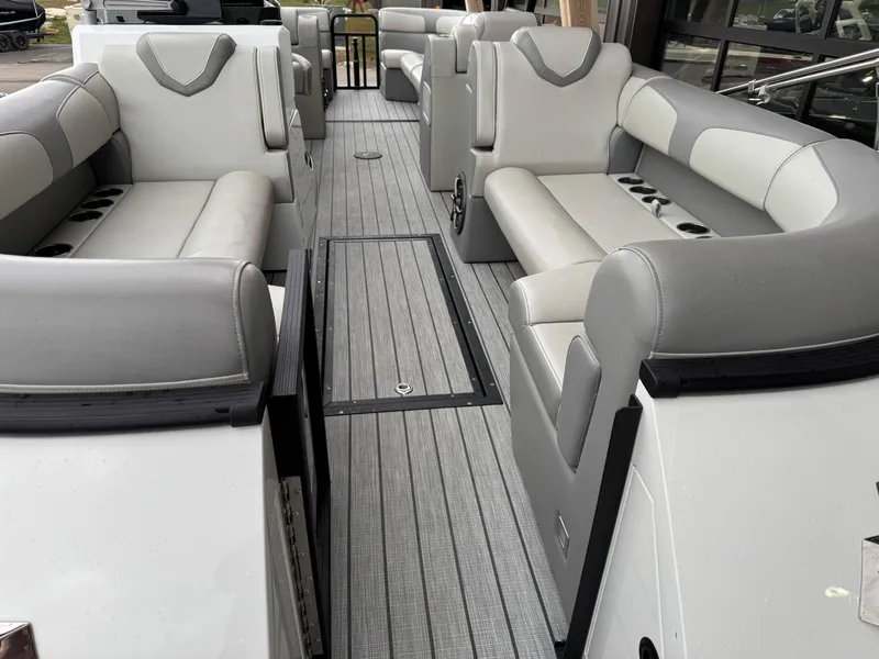 Slide: The Image of 2022 Montara SURF BOSS 25 boat interior with gray seating and sleek design. - 5