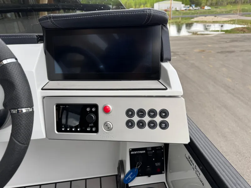Slide: The Image of 2022 Montara SURF BOSS 25 dashboard with touchscreen and control panel. - 9