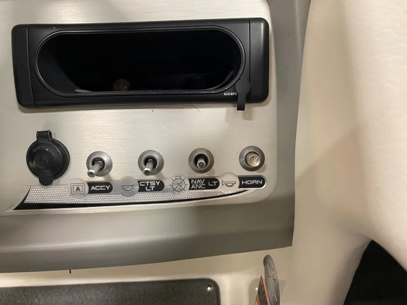 Slide: The Image of Control panel of a 2011 Bayliner 197 boat with accessory switches. - 10