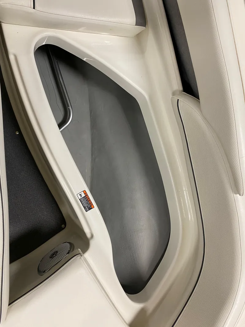 Slide: The Image of Interior storage compartment of a 2011 Bayliner 197 boat. - 16