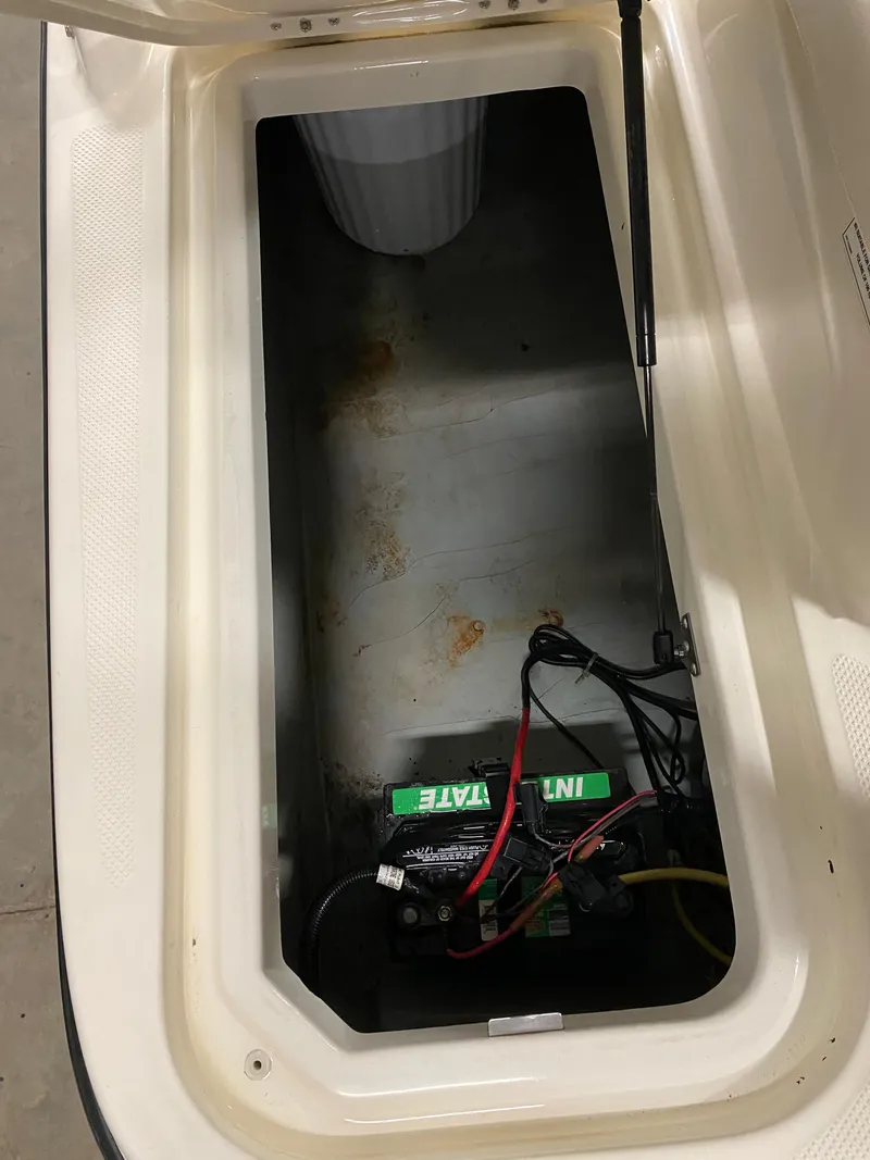 Slide: The Image of Battery compartment of a 2011 Bayliner 197 boat with Interstate battery. - 23