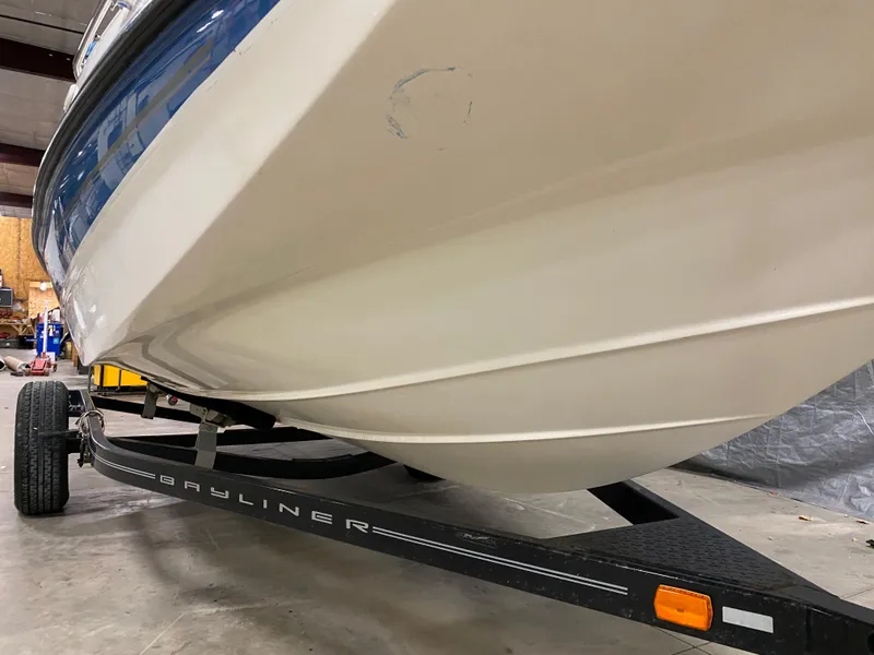Slide: The Image of 2011 Bayliner 197 boat on trailer in garage. - 26