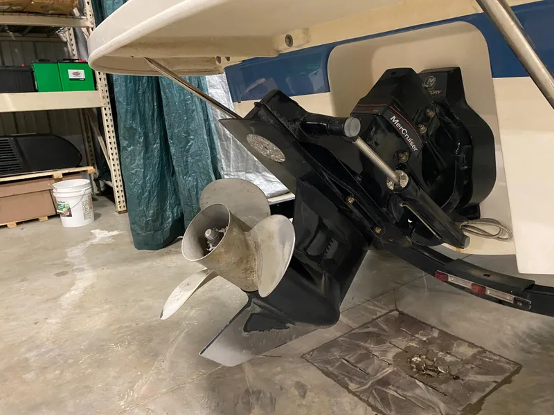 Slide: The Image of Bayliner 197 2011 boat propeller and stern drive in a storage facility. - 5