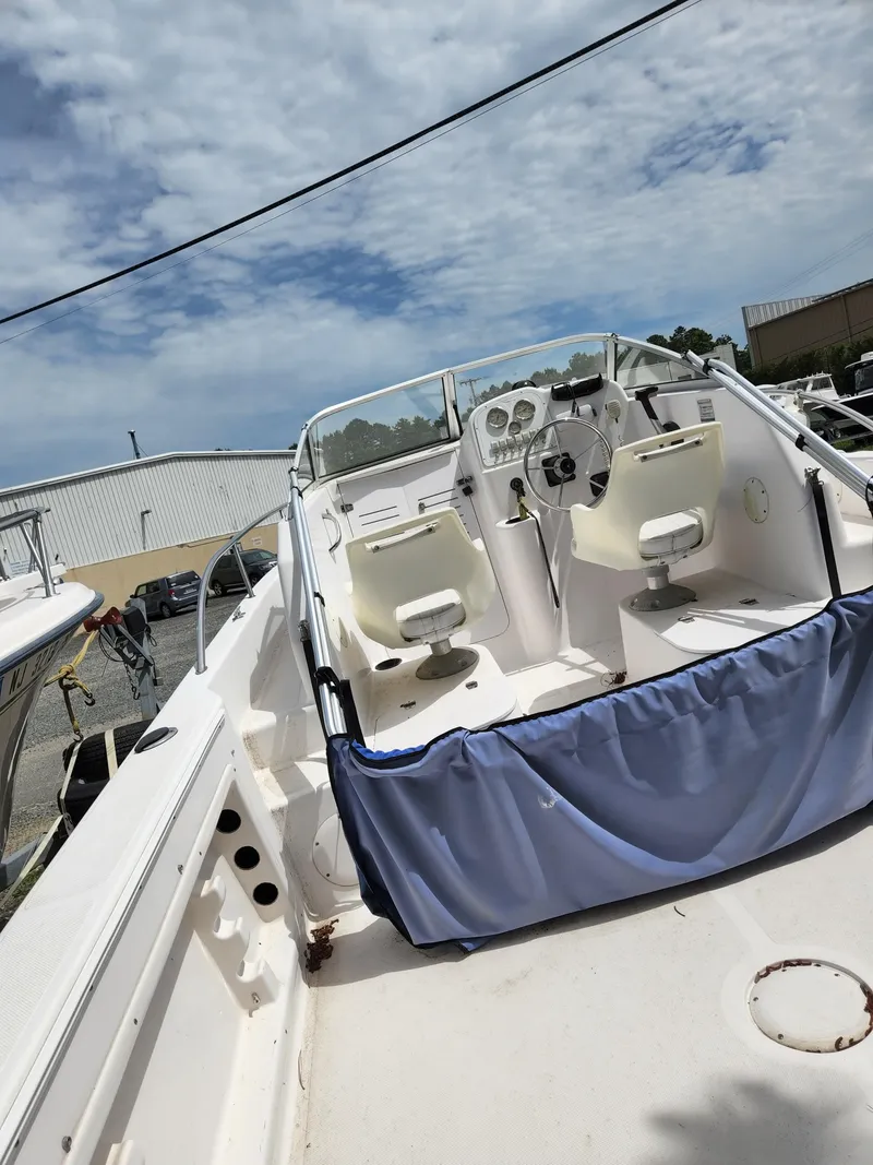 Slide: The Image of 2006 Pro-Line 23 Walk boat with dual seats and steering console. - 12