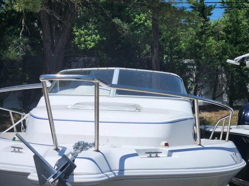 Slide: The Image of 2006 Pro-Line 23 Walk boat with stainless steel railings and anchor. - 2