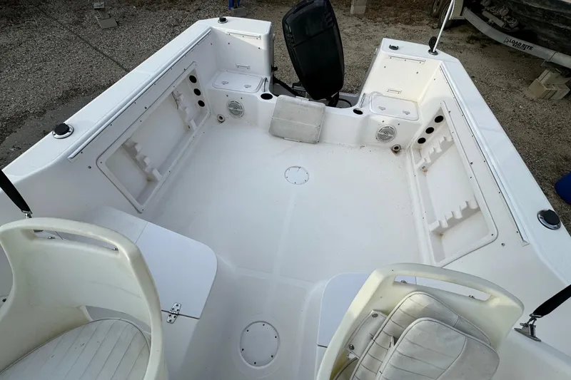 Slide: The Image of 2006 Pro-Line 23 Walk boat interior with seating and storage compartments. - 22