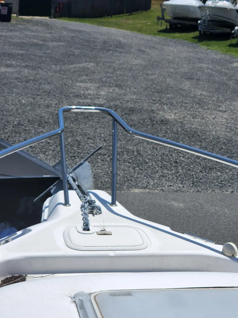 Slide: The Image of 2006 Pro-Line 23 Walk boat bow with anchor and railing. - 5