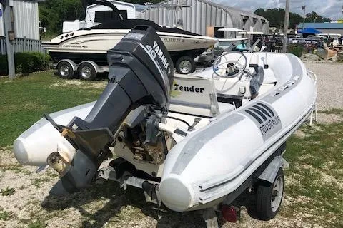 Slide: The Image of 1995 Novurania Tender boat with Yamaha outboard motor on trailer. - 4